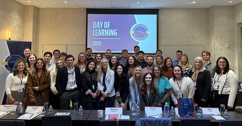 Group of men and women at a conference