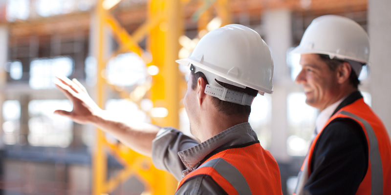 Contractors viewing construction scene