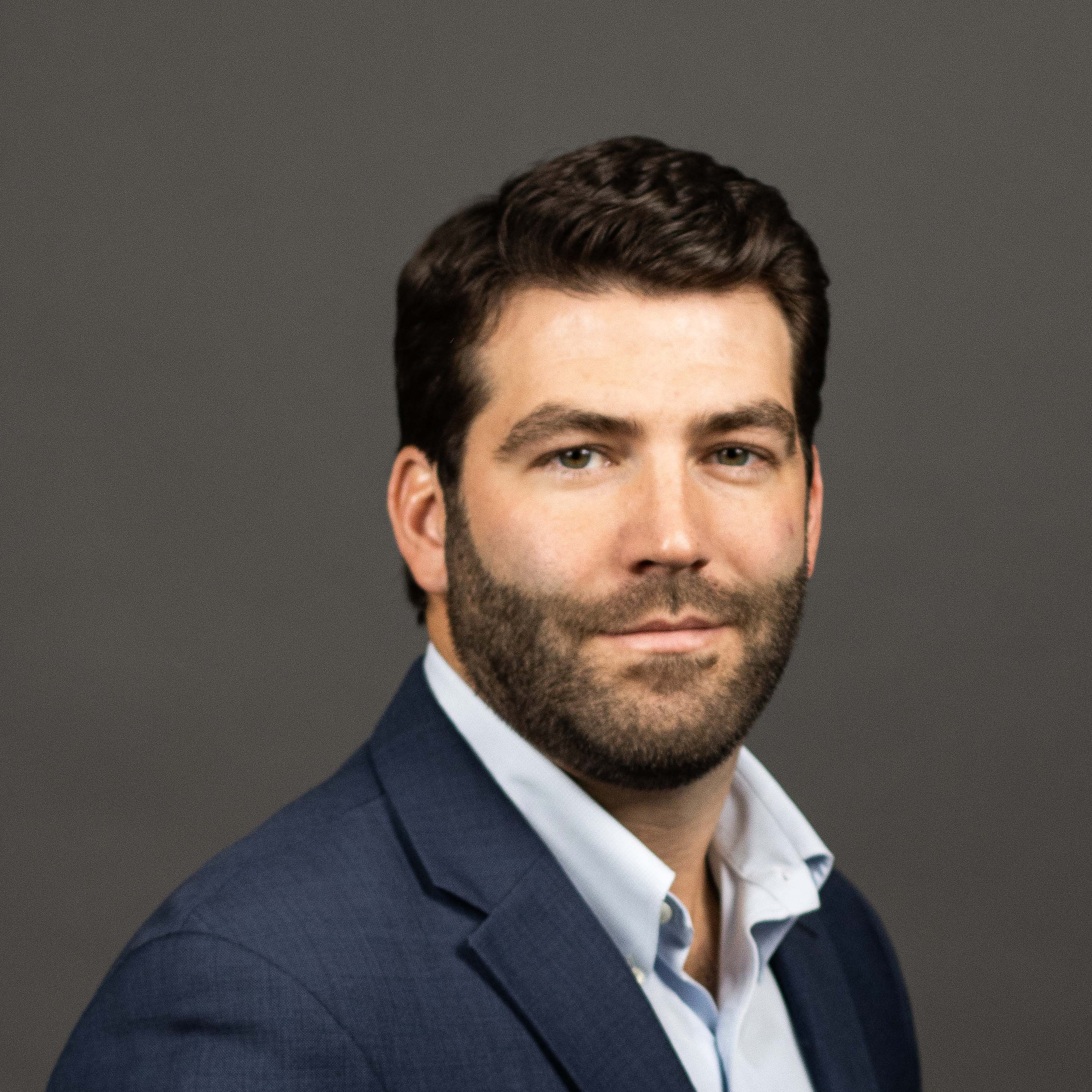 Professional headshot of Tim Gleason