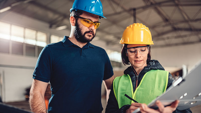 Safety Managers with clipboard