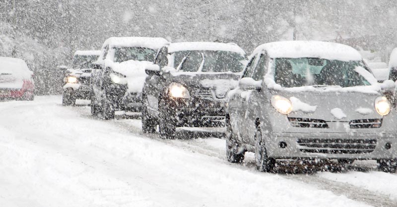 Cars driving in winter storm