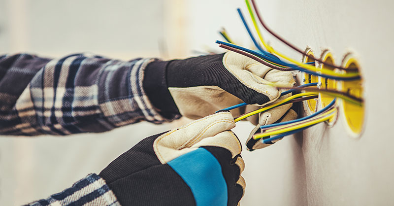 Electrician wiring a construction site