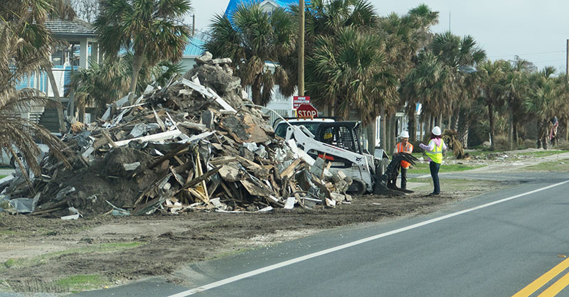 Workers cleaning up after hurricane