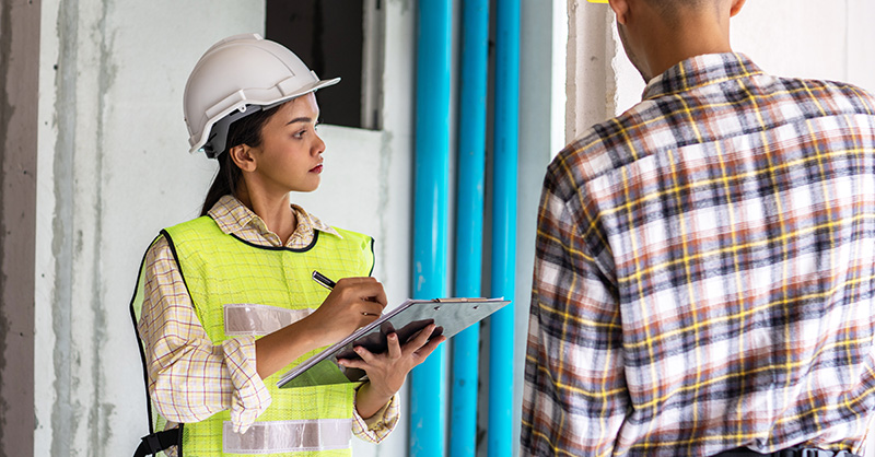 Construction workers performing recordkeeping duties