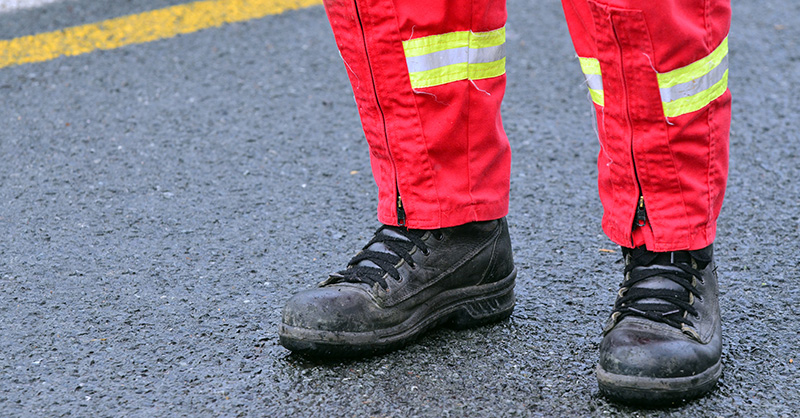 Red cross worker cleaning up after wildfire
