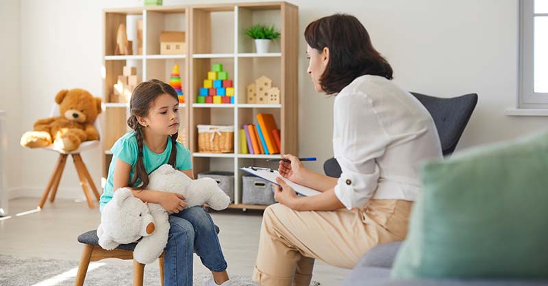 Adult de-escalating a situation with an emotional child