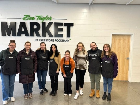 Employees in Cincinnati office volunteering at the Freestore Foodbank