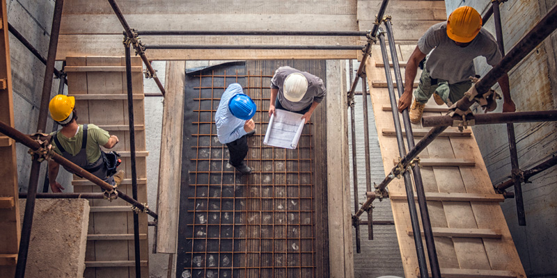 looking down at construction workers