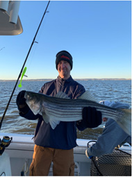Gordon Lewis with striped bass