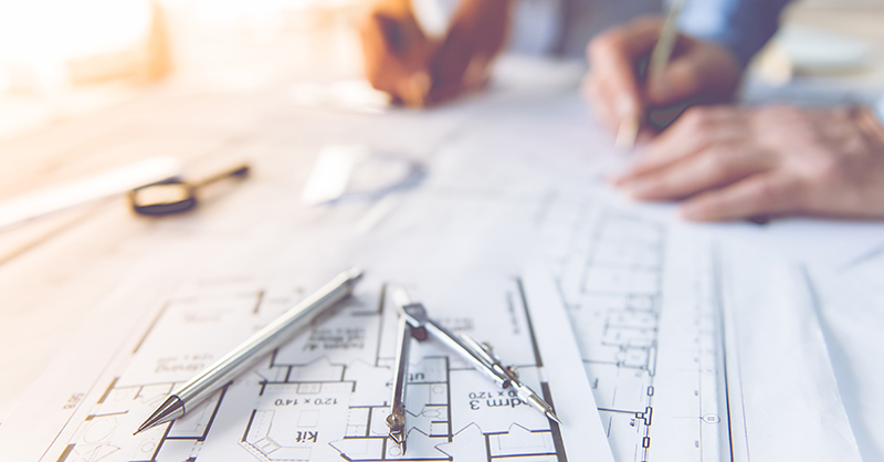 Two design professionals working on a project.