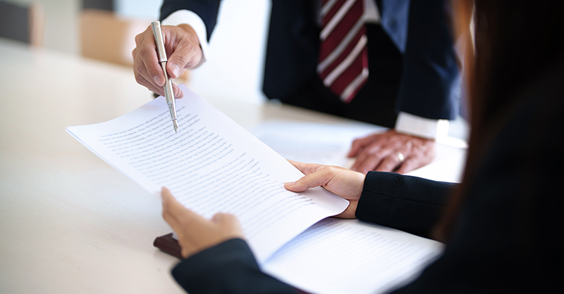 Professionals reviewing paperwork