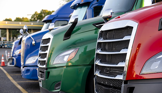 Line of commercial transportation trucks
